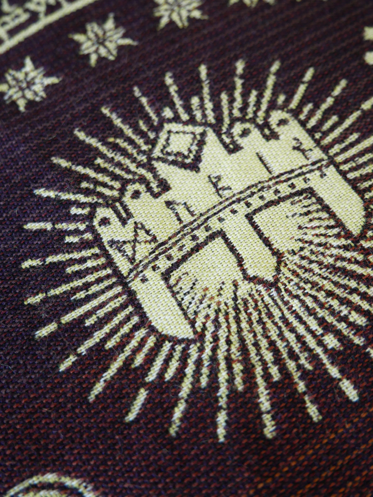 Close-up of a woven pattern with geometric design on fabric