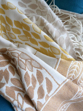 Close-up of patterned fabric with geometric designs on a blue background