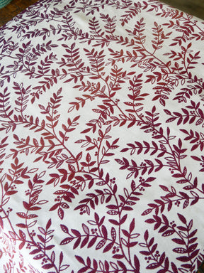 Fabric with Burgundy purple leaf pattern on a white background